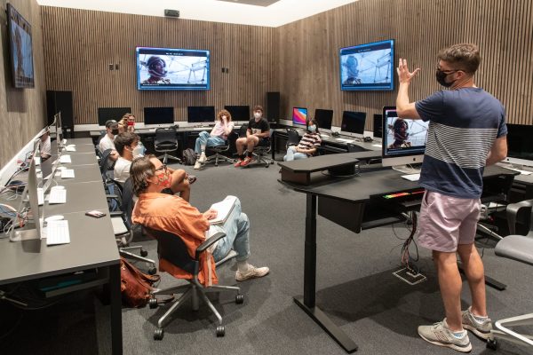 Adam Schoenberg, Associate Professor, Composition, works with students in the Production Lab of the Music Department's new Choi Family Music Production Center, Booth Hall on Nov. 16, 2021.
(Photo by Marc Campos, Occidental College Photographer)